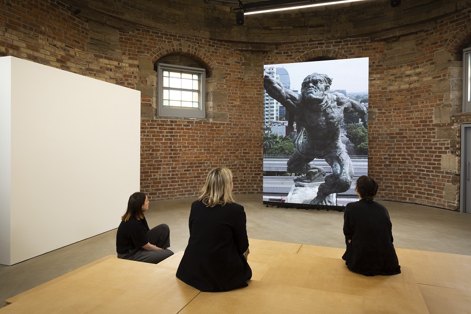 People looking at Smashing Monuments by Sebastian Diaz Morales inside the City Observatory. Credit - Eoin Carey.