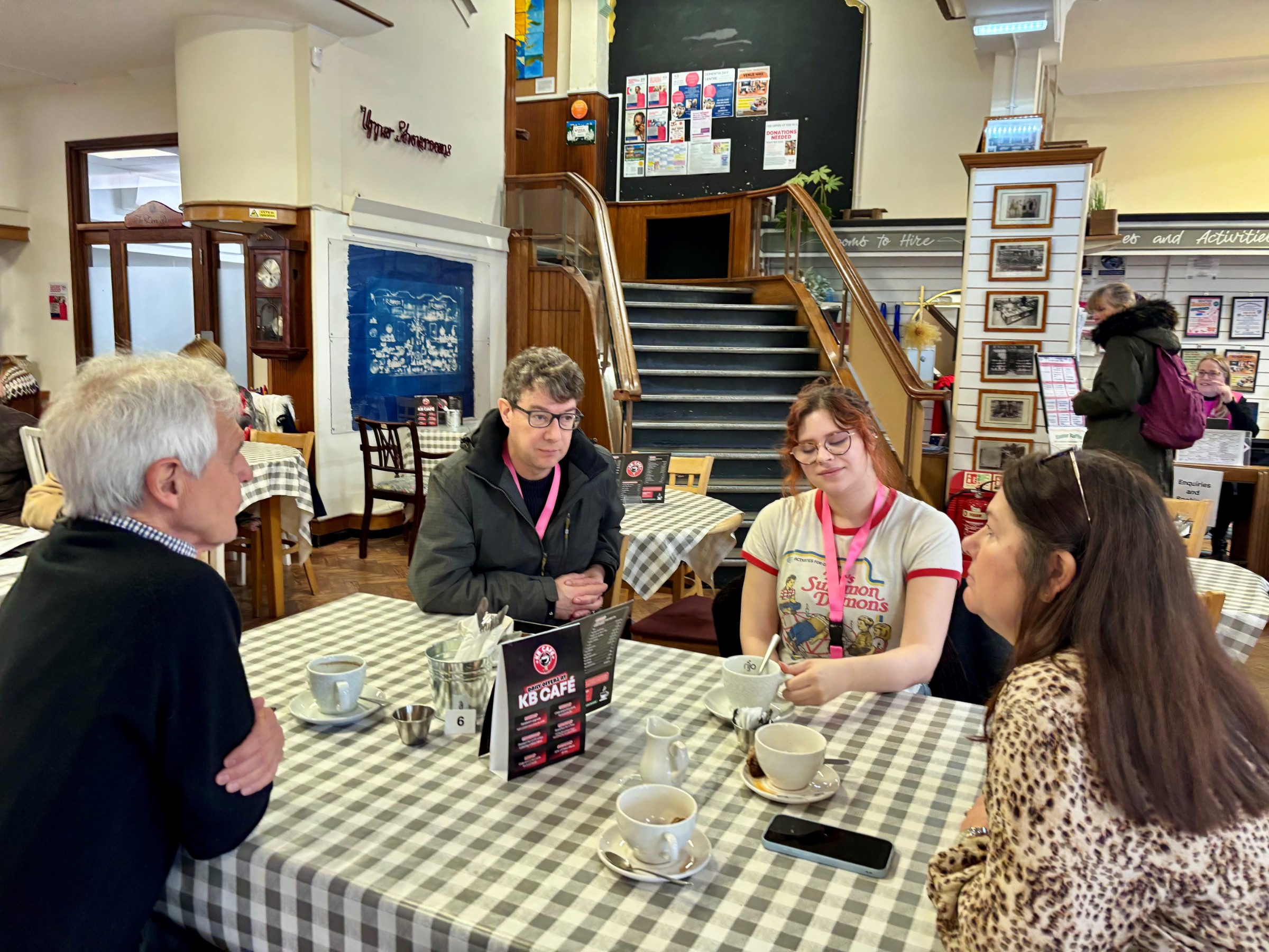 AHF team meeting people at The Haven cafe.